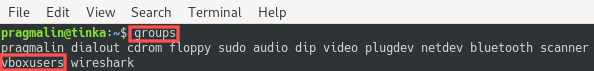 Terminal screenshot of the groups command. Its output shows that the user does belong to the vboxusers group, after we added it using the usermod command.