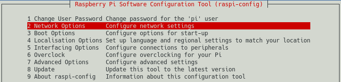 raspi-config screenshot of the main menu, showing the selection of the Network Options. This is step 1 in configuring Wi-Fi access.