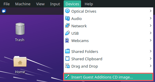 Screenshot that shows you how to insert the VirtualBox guest additions CD image into the virtual machine's emulated CD drive.
